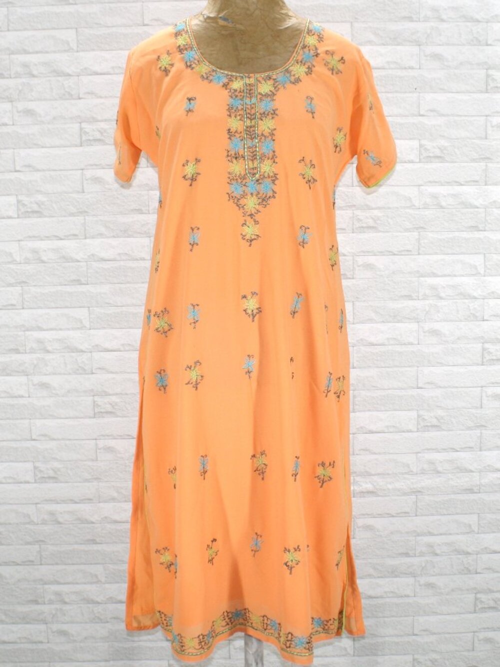 Peach Embroidered Women Kurta with Blue-Yellow Floral Detailing